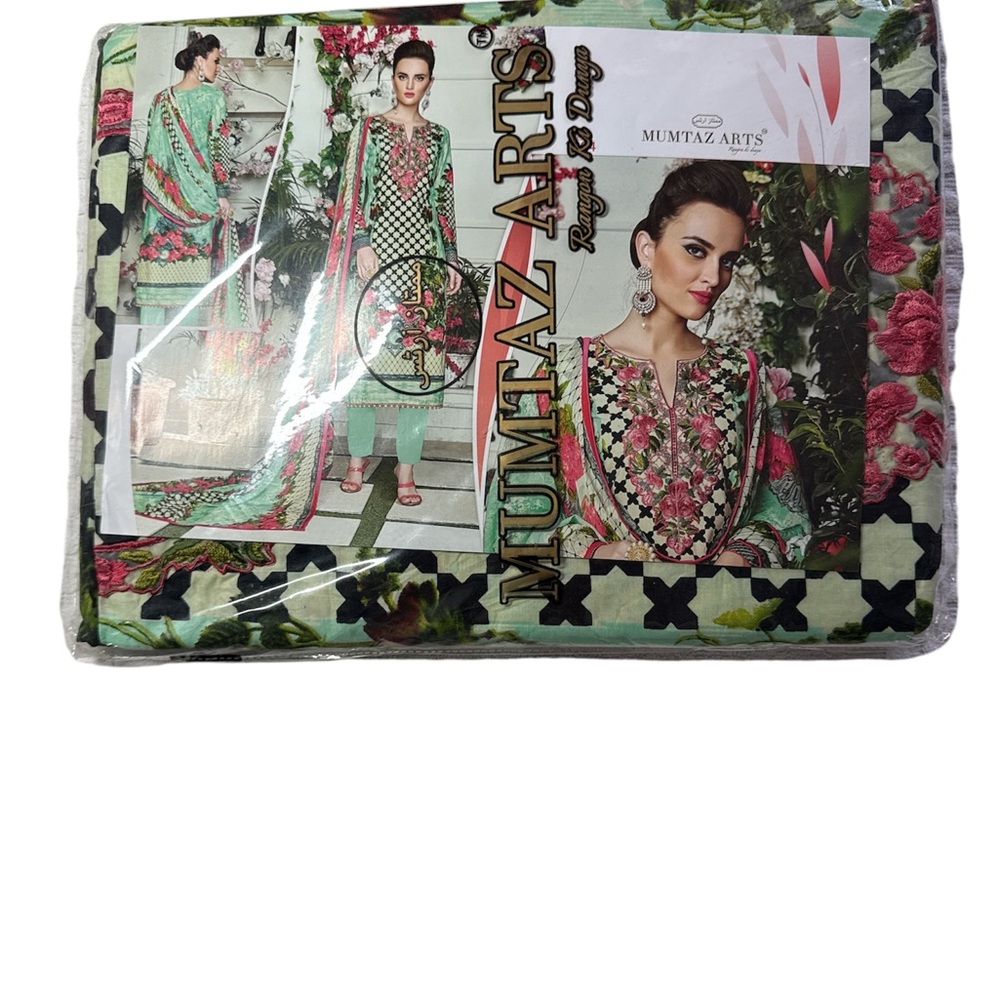 Green and Pink Traditional Dress with Intricate Patterns